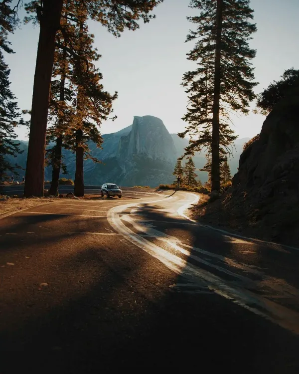 An SUV driving on a curve